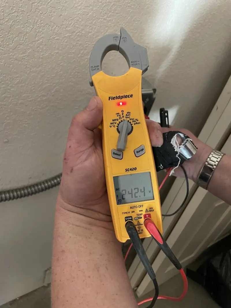 Voltage testing with clamp meter during Ceiling Fan Installation in Faribault
